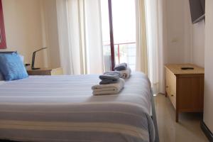 A bed or beds in a room at Dream Cuesta