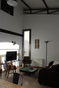 TV a/nebo společenská místnost v ubytování Ma Maison