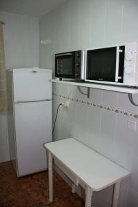 Una cocina o kitchenette en Apartamentos Ruidera