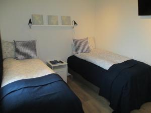 Postel nebo postele na pokoji v ubytování Lækjaborgir Guesthouse