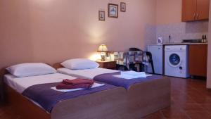 Postel nebo postele na pokoji v ubytování Villa Budvanka Guesthouse