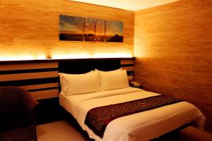 En eller flere senger på et rom på Hotel Time Boutique Nilai