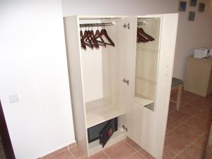 a walk in closet with shoes on racks at Miramar Pansiyon in Kaş