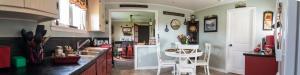 a kitchen with a sink and a counter top at Mama`s By The Sea B&B in Clark's Harbour +36 photos