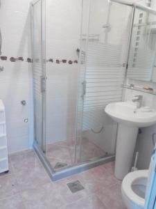 a bathroom with a shower and a sink at Apartments Stevanovic in Bar +56 photos