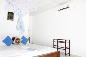 Postel nebo postele na pokoji v ubytování Freedom Home Stay