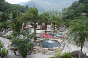 a resort with a pool and a water park at Go Ya Hot Spring in Heping