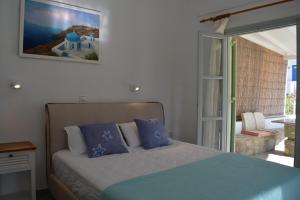 Postel nebo postele na pokoji v ubytování Klados Studios & Apartments