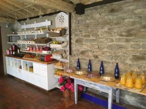 a bakery with a table with food on it at Hotel Palacio de Elorriaga in Vitoria-Gasteiz