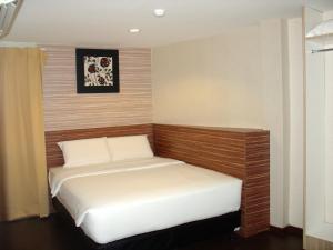 a small bedroom with a bed in it at Alor Boutique Hotel Sdn Bhd in Kuala Lumpur