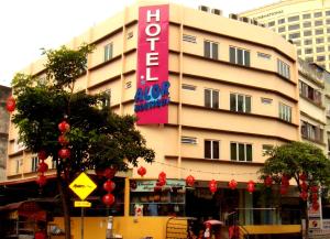 a building with a sign on the side of it at Alor Boutique Hotel Sdn Bhd in Kuala Lumpur