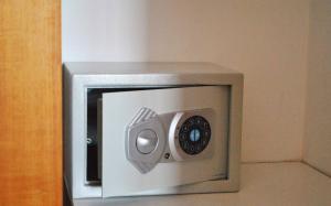 a microwave oven with a security camera on it at 123 Soleil Studios in Agia Marina Aegina