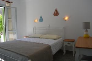 Postel nebo postele na pokoji v ubytování Klados Studios & Apartments