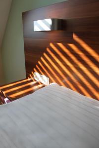 A bed or beds in a room at Sky Apartments Vienna 