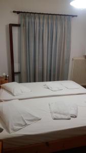 Voodi või voodid majutusasutuse Hotel Aris toas