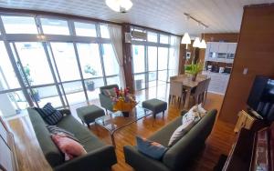 a living room with two couches and a table at Tomonoya Ishigaki in Ishigaki Island