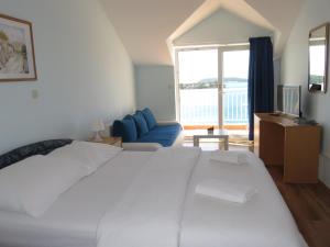 Cama o camas de una habitación en Apartments Jurišić
