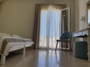 Postel nebo postele na pokoji v ubytování Alkyon Hotel