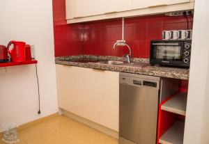 Kuchyň nebo kuchyňský kout v ubytování Fantastic Apartment Marilyn Orlando 85