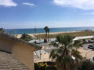 a view of the beach from a building at Beach House in Castelldefels