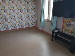 TV a/nebo společenská místnost v ubytování K Guesthouse