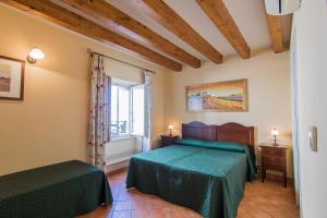 A bed or beds in a room at Apollo B&B