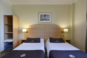 Postel nebo postele na pokoji v ubytování Tulip Inn Turin West Rivoli
