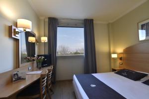 Postel nebo postele na pokoji v ubytování Tulip Inn Turin West Rivoli