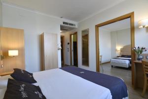 Postel nebo postele na pokoji v ubytování Tulip Inn Turin West Rivoli