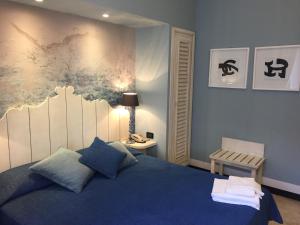 Da ö Vittorio SRL客房内的一张或多张床位