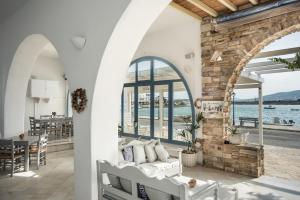 a living room with a view of the water at Hotel Mantalena in Antiparos Town