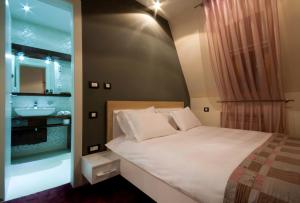 Un pat sau paturi într-o cameră la Hotel Soa