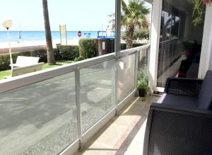 a balcony with a view of the beach at Playa Esquirol in Cambrils