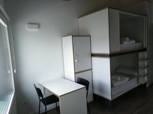 A bed or beds in a room at Agora Hostel