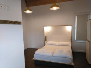 A bed or beds in a room at Agora Hostel