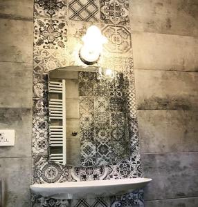 a bathroom with a mirror on a wall at Faros oasis in Gdinj +64 photos