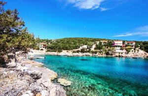 a large body of water with a group of houses at Faros oasis in Gdinj