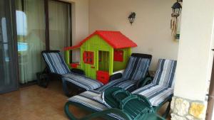 A seating area at Private Villa 102 with heated pool in BlackSeaRama