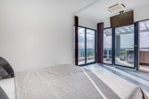 Postel nebo postele na pokoji v ubytování Villa Panorama