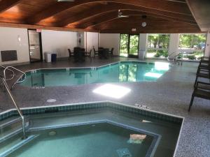 a large swimming pool in a building with at The Landing Resort in Egg Harbor
