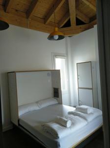 A bed or beds in a room at Agora Hostel