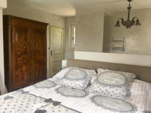 Postel nebo postele na pokoji v ubytování BASTIDE DE L' ORANGERAIE