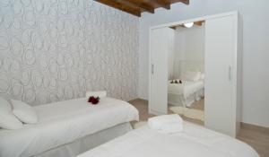 Posteľ alebo postele v izbe v ubytovaní Casa Valeria