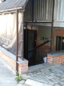 an entrance to a building with a sign on it at Lviv Loft Prison in Lviv