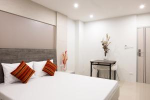 เตียงในห้องที่ DB Plus 5