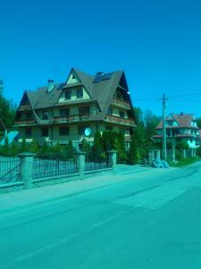 a large house on the side of a street at U Dany in Białka Tatrzańska