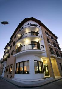 a large building with balconies on the side of it at Royiatiko Hotel in Nicosia