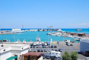 a view of a harbor with cars parked in a parking lot at Victoria Royal Apartments in Termoli