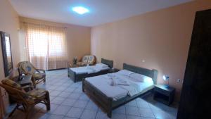Postel nebo postele na pokoji v ubytování Hotel Zeus