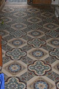 a tiled floor with a design on it at Herrenhof in Worms